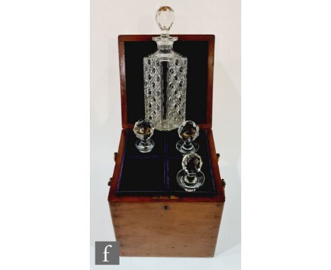 A 19th Century mahogany four divisioned purple felt lined decanter box, fitted with cut glass square decanters and stoppers, 