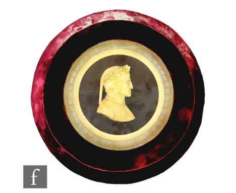UPDATED A late 19th Century wax side profile portrait, possibly of Dante, in recessed maroon frame, width 28cm.