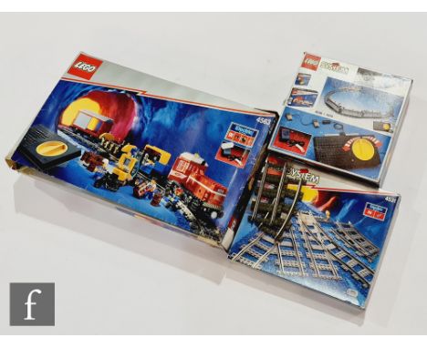 A collection of Lego, 4563 Load N' Haul Railroad, 4531 Manual Points with Track and 4548 Transformer and Speed Regulator, all
