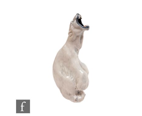 A large Royal Copenhagen model of a growling polar bear, model 502, printed and painted mark, height 32cm. 