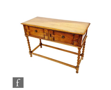 A small 1920s light oak geometric moulded front two drawer buffet sideboard on spiral legs united by rail stretchers, height 
