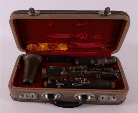 A clarinet in original case, Hsinghai, made in China.