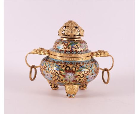 A partly pierced cloisonné koro with horizontal ringed ears, China, 20th century. Gilt knob and openwork enamel, h 14 cm.