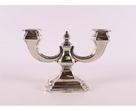 A second grade 835/1000 silver two-light candlestick, 1st half of the 20th century. Gross weight 352 grams.