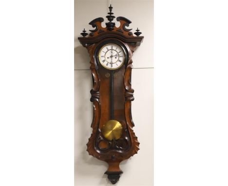 A Viennese model regulator, around 1900. Mahogany glued case with carved Jugendstil leaf decoration, white enamel dial with R