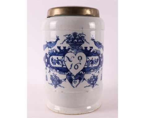 A Delft blue pottery albarello apothecary jar with brass lid, Holland 18th century. Decor of cartouche crowned with peacocks 