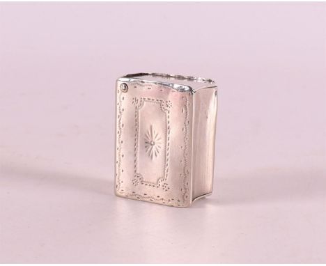 A second grade 835/1000 silver snuff box in the shape of a book, hammered decor, 1st half 19th century.