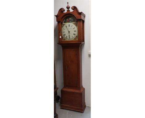 A longcase clock in walnut stained softwood case, England 19th century. The shade is volute and center vase, straight case wi