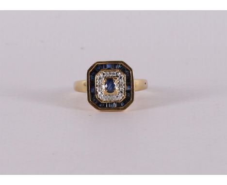 An 18 carat 750/1000 gold ring with facet cut blue sapphires and brilliants. Ring size 18.25 mm.