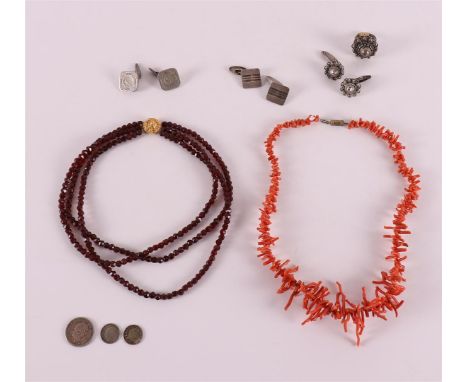 A lot of various jewellery, including sticks, precious corals and a silver ring.