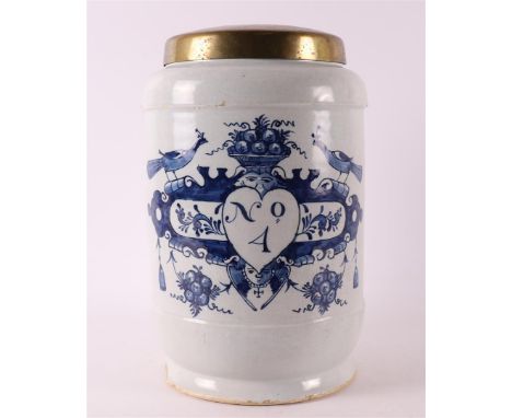 A Delft blue pottery albarello apothecary jar with brass lid, Holland 18th century. Decor of cartouche crowned with peacocks 