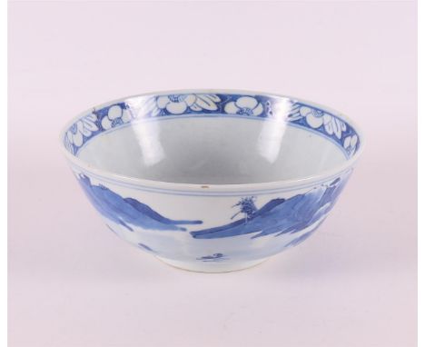 A blue and white porcelain bowl on a stand ring, China, 20th century. Blue underglaze decor of a landscape, marked with four 