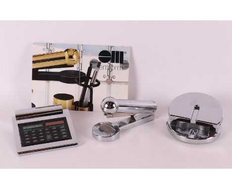 A chrome metal design desk set, consisting of: hole punch, calculator and stapler, tot. 3x.