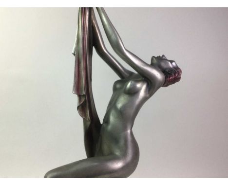 ART DECO STYLE FIGURAL LAMP the figure in the form of a lady posed holding a torch55cm highThe lady figure is made from resin