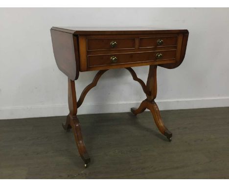 YEW WOOD SOFA TABLE fitted with two short over one long drawer, on castors71cm high, 67cm wide, 46cm deep 