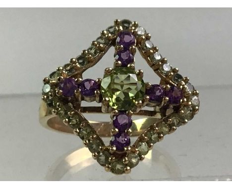 TWO DRESS RINGS including an amethyst and diamond example and an amethyst and peridot example, each in nine carat goldThe rin