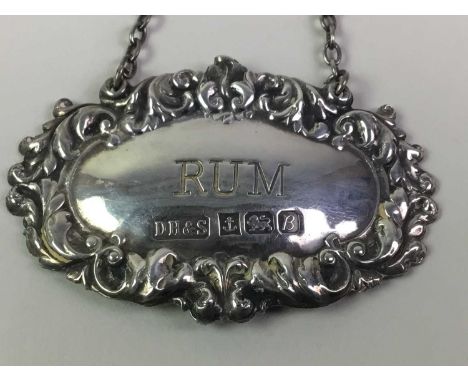 SILVER RUM DECANTER LABEL AND SILVER COFFEE SPOONS the decanter label hallmarked for Birmingham 1976, as well as six silver c