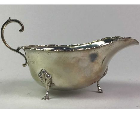 COLLECTION OF SILVER comprising a silver saucer boat, silver sauce ladle, a silver Christening fork and spoon set, and silver