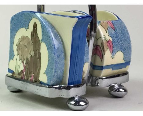 CLARICE CLIFF BIZZARE SUGAR AND CREAM BLUE JAPAN PATTERN  circa 1930, painted in shades of pink, blue and brown on a chrome s