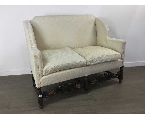 TWO SEAT PARLOUR SOFA upholstered in cream, with carved oak frame115cm wideGood clean overall condition,  frame solid. Some d