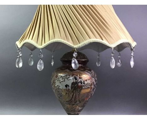 JAPANESE CERAMIC TABLE LAMP  decorated with figures in a garden setting, with shade