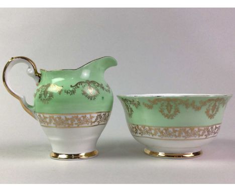 TUSCAN PART TEA SERVICE with gilt decoration on a white and green ground