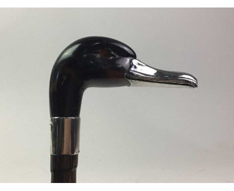 SILVER MOUNTED UMBRELLA AND TWO MOURNING PARASOLS  the umbrella handle modelled as a duck's head with silver bill and collar,