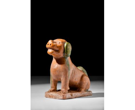 Possibly Ming Dynasty, Ca. AD 1368-1646.A Ming dynasty ochre-glazed terracotta dog depicted sitting on its haunches, with its