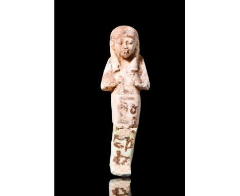 Late to Ptolemaic Period, Ca. 664-30 BC.A charming mummiform ushabti of a light stone colour, with the characteristic blue gl