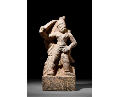 Possibly Gandharan, Ca. AD 300 or later.A dynamic stone statue featuring a male warrior who is elevated on a rectangular plin