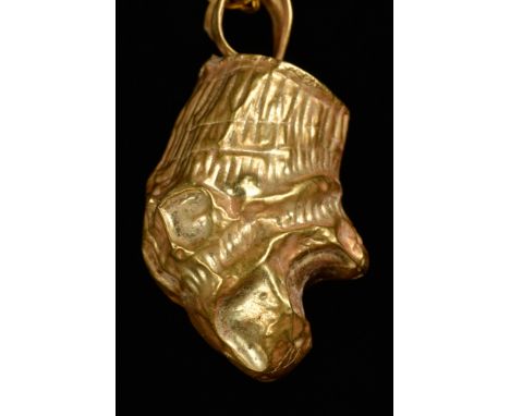 Hellenistic Period, Ca. 200 BC.A gold terminal pendant with a lion head with an open mouth and suspension loop with a gold ne