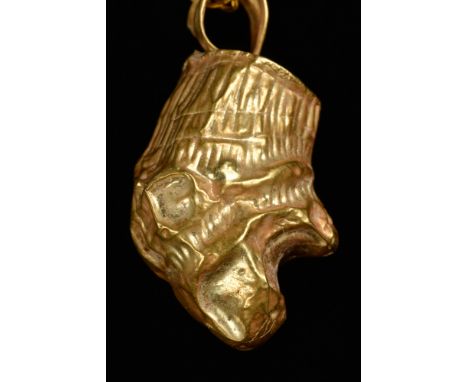 Hellenistic Period, Ca. 200 BC.A gold terminal pendant with a lion head with an open mouth and suspension loop with a gold ne