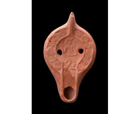 North Africa, Ca. 400-500 AD.A fine pottery oil lamp The Atlante X; Hayes II A type. The lamp stands on a low ring foot, and 