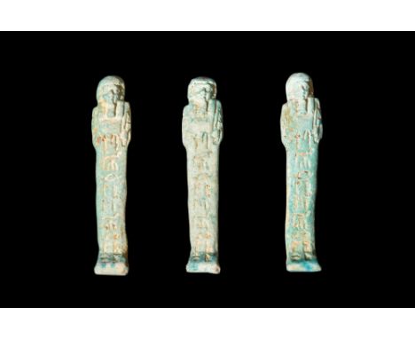 Late Period, 30th Dynasty, Ca. 332 BC.A group of three ushabtis crafted from light blue glazed composition. The front and the