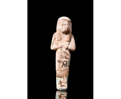 Third Intermediate Period, Ca.1075 - 656 BC.A lovely mummiform ushabti of a light stone colour, with the characteristic blue 