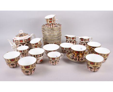 A Royal Crown Derby "Old Imari" 1128 pattern teaset, comprising teapot, two sugar bowls, two cream jugs, six cups with saucer