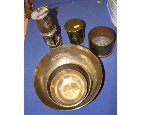 Two pieces of trench art, three bowls and a "Bests Safety Lamp" miner's lamp 