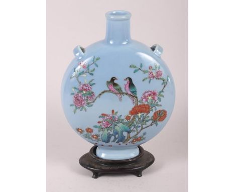 A Chinese moon flask with famille rose decoration of birds and flora, 9 1/2" high, with hardwood stand Condition: Overall goo