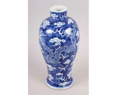 A 19th century Chinese blue and white oviform vase, decorated dragons on a cloud ground with four character mark to base, 10 