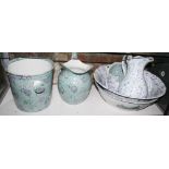 A Chintz decorated toilet set and another similar with blue marbled decoration
