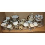 A Paragon floral edged teaset, another teaset and a coffee set