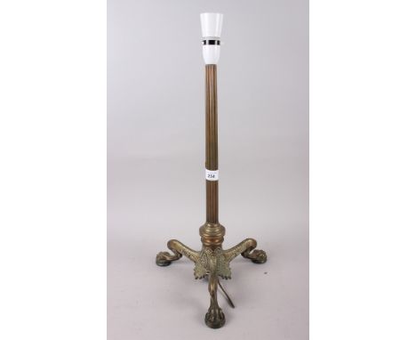 A brass table lamp with reeded column, on three claw feet, 19" high 