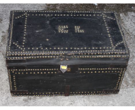 A Victorian black nailed leather trunk, lid decorated initials "CL", 24" wide x 14" deep x 13 1/2" high 