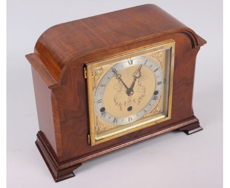 A 20th century mantel clock by Elliott, in walnut case, Westminster and Whittington chimes, 9" high 