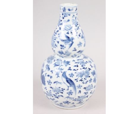 A 19th century Chinese blue and white double gourd vase, decorated birds amongst foliage, 7" high Condition: Small chips to t