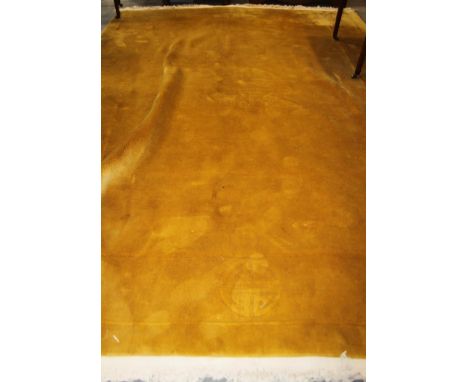 A Chinese wool contour pile carpet with traditional symbols, 148" x 106" approx (faded) 