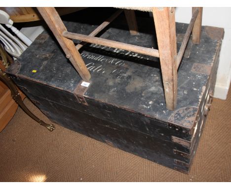 A black painted pine trunk with lid inscribed "Miss P G Melitus", 39" wide 
