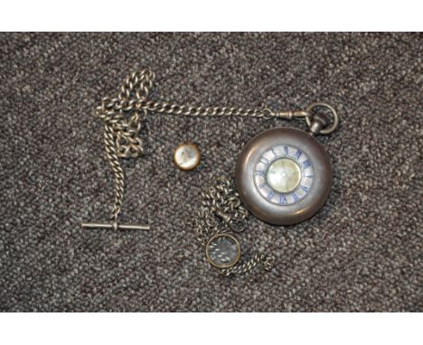 A silver pocket watch and chain