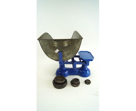 A set of blue painted scales, with weights