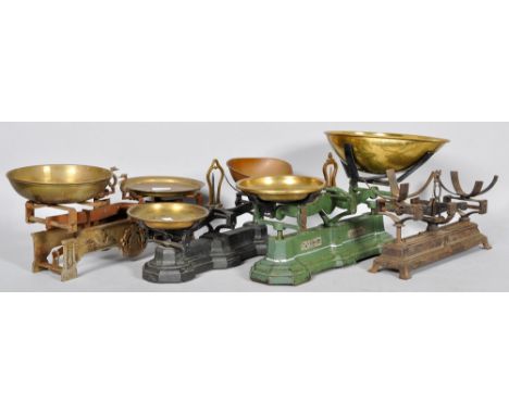 A set of four vintage cast metal and brass scales